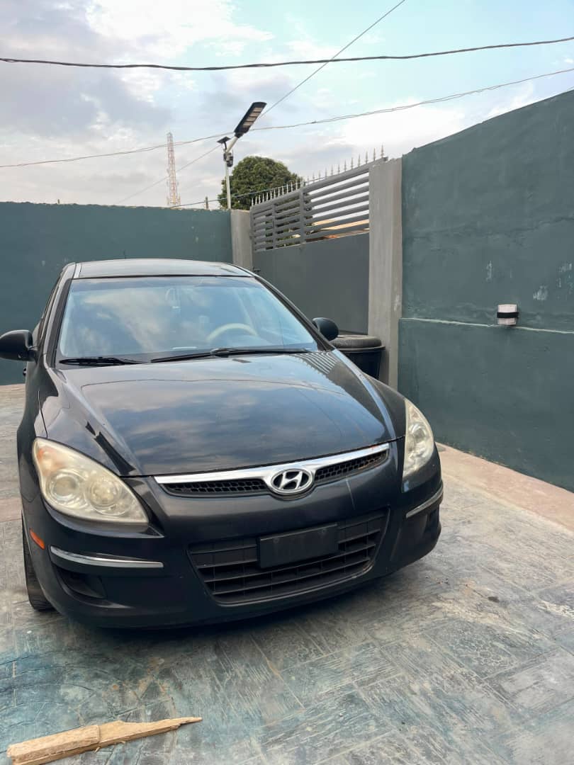 Black 2012 Hyundai Touring side view