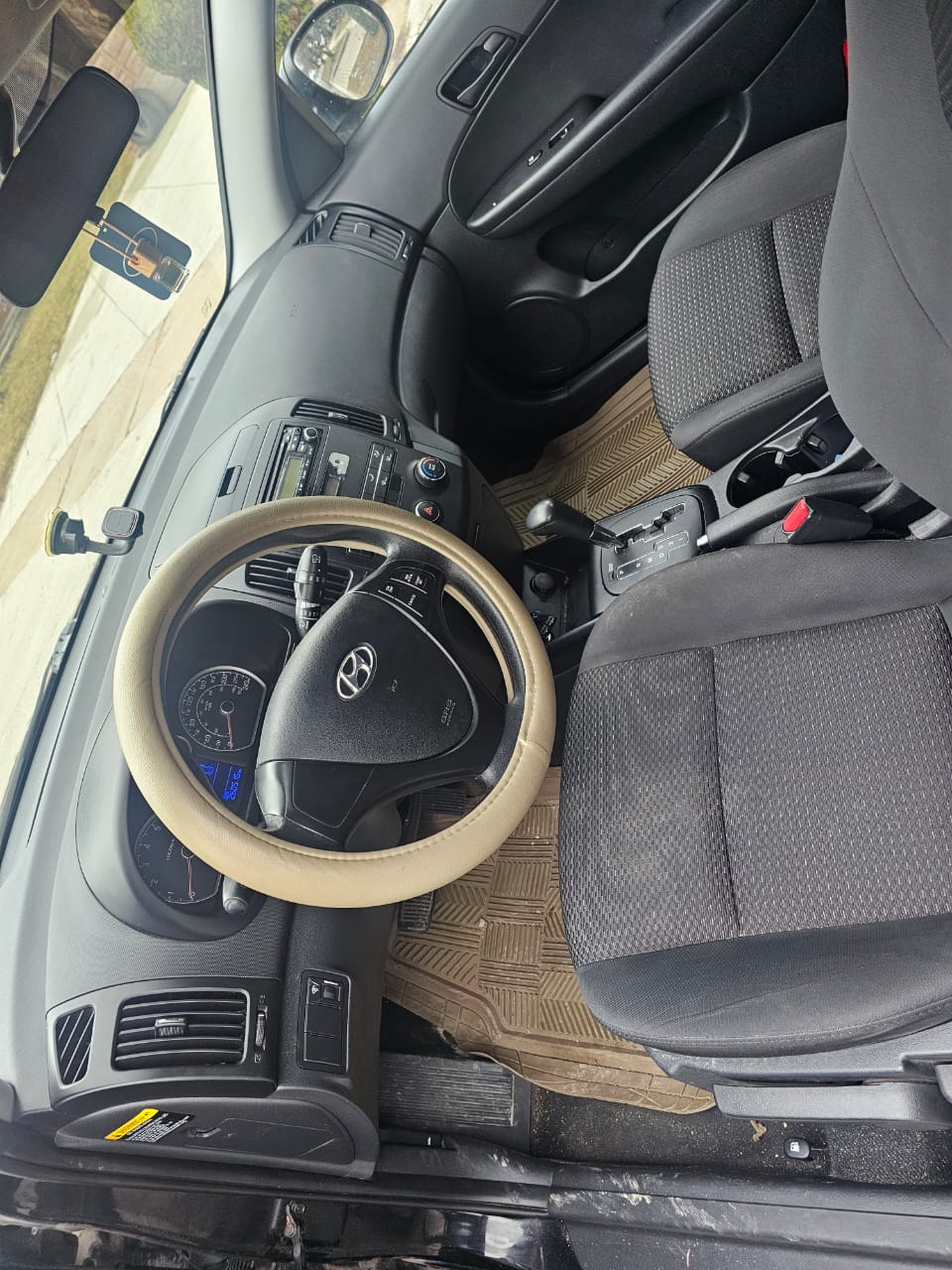 Black 2012 Hyundai Touring rear view